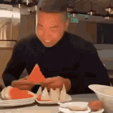 gif of asian man eating watermelon