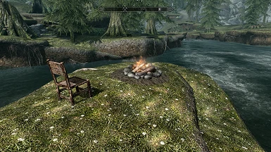 Small campfire and chair with great river view