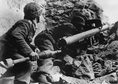 Wehrmacht soldiers preparing to fire
