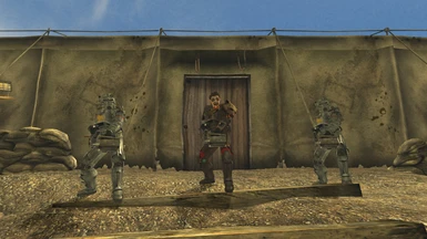 Three NCR Heavy Troopers, each one armed with a handheld M2 Browning.