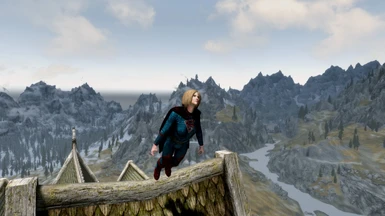 The cape is from Cloaks of Skyrim