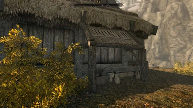 Go around to the right side of the inn for a small blacksmithing station.