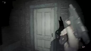 Now is his chance, while the door is guarding him. Ethan awkwardly begins to change his magazine...