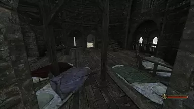 The barracks of the outer walls guard. During a siege, beds will be removed and weapons will be taken from racks.