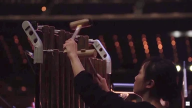 Percussionist performing on the tubular bells on the FINAL FANTASY VII REMAKE Orchestra World Tour
